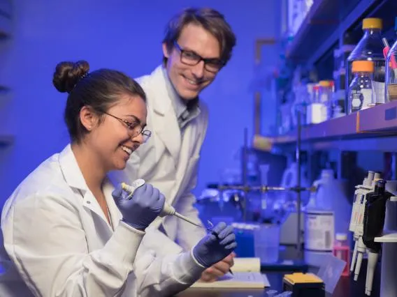 Student and professor working together in lab