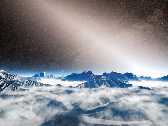 Exozodiacal dust is depicted as a white, glowing haze above the mountainous horizon of a hypothetical exoplanet in this artist's depiction. 