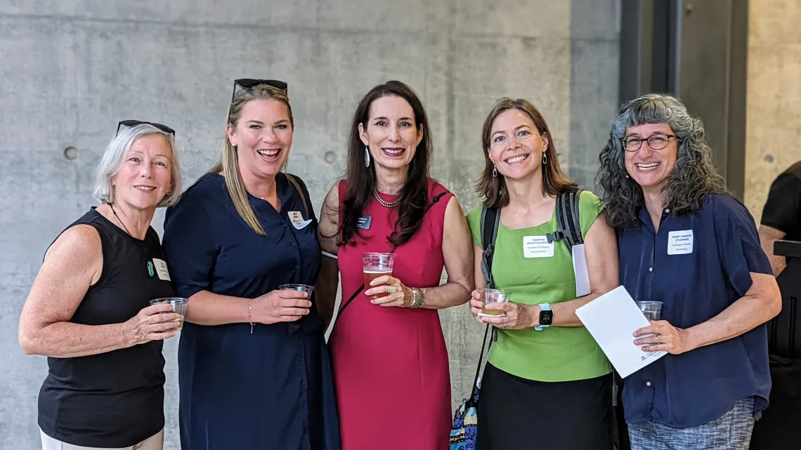 Lee Ryan, Ashley Jordan, Rebecca Gomez, Martha Bhattacharya, and Mary Frances O'Connor stand together smiling at the 2022 Annual Faculty Reception