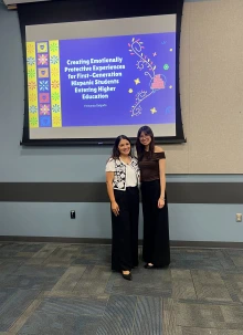 Photo of Fernanda and Dr. Arizmendi in front of presentation 